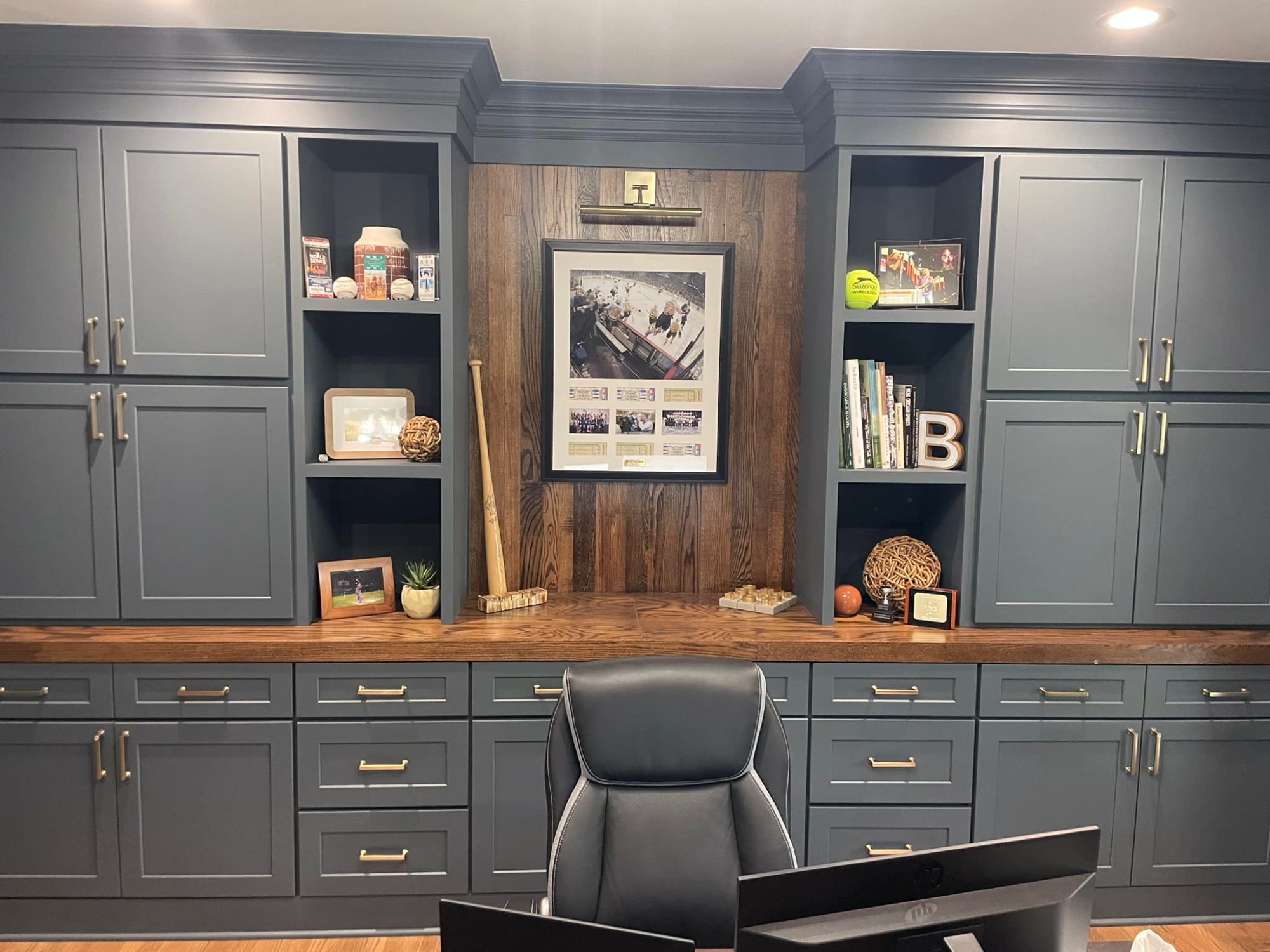 Custom built-in home office – slate blue cabinetry with reclaimed wood desk